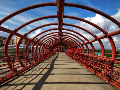 Brown wooden bridge under the blue sky during the day
